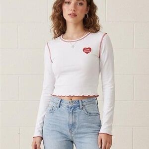 Dolls Kill x Care Bears White Long Sleeve Crop Top with Red Trim